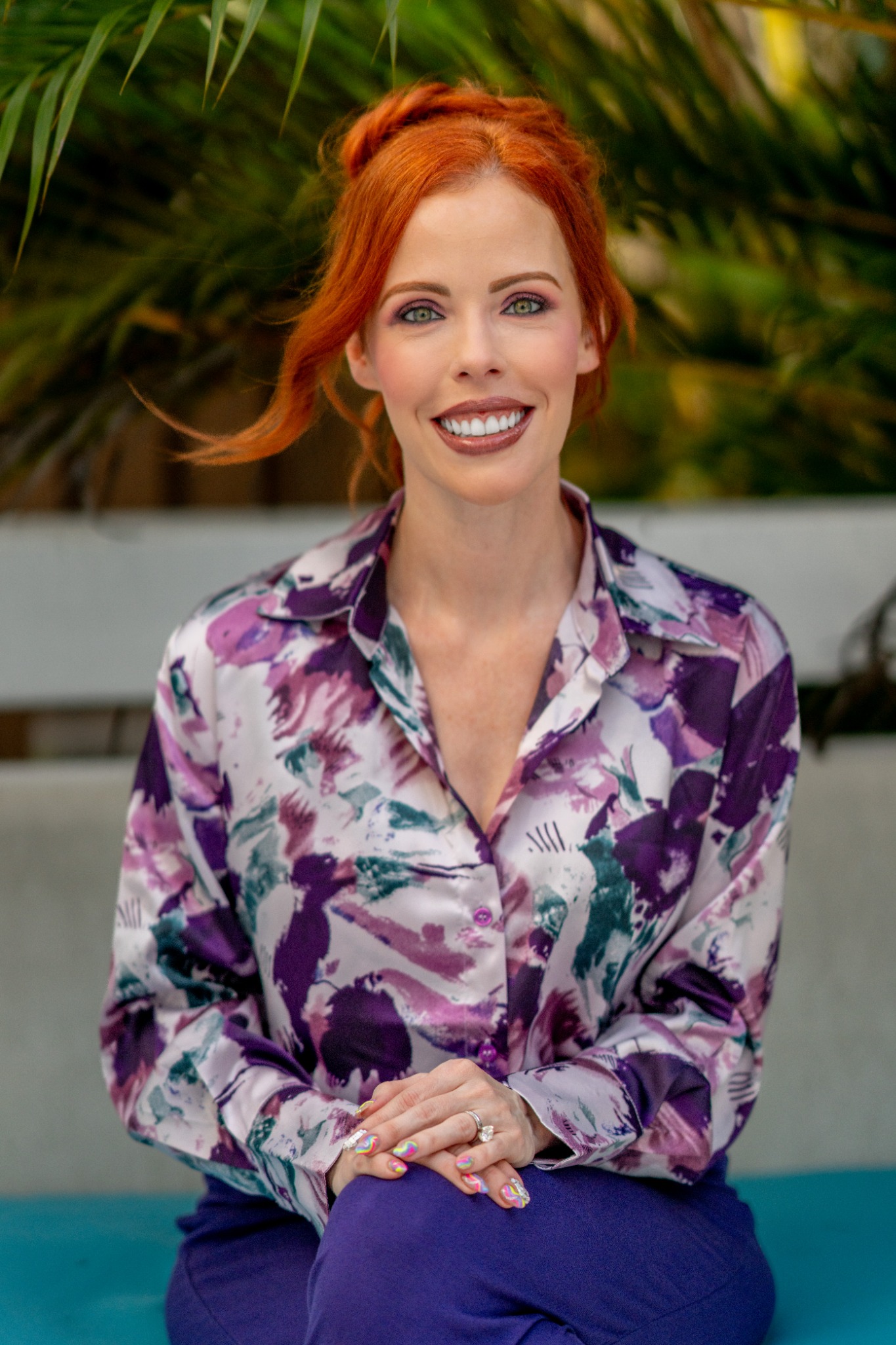 Dr. Laura Purdy in a purple floral blouse.