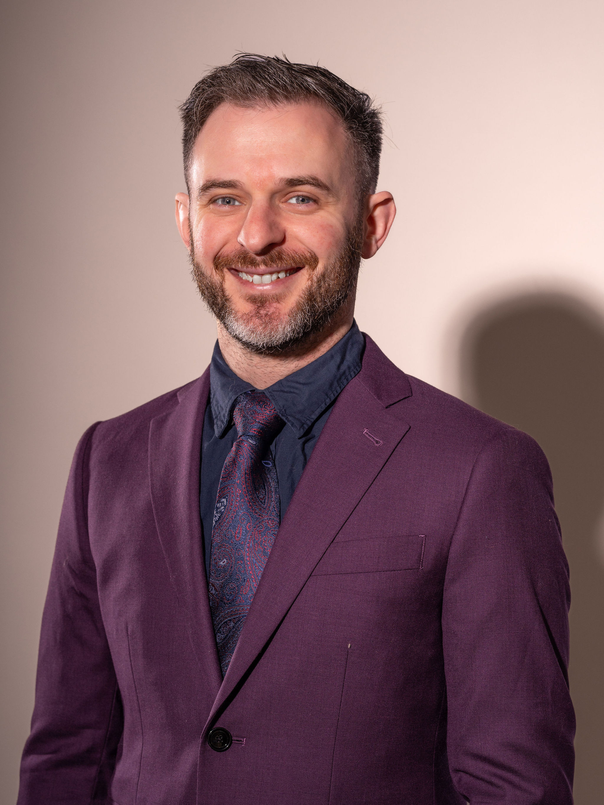 Dr. Stacey Podkovik in his purple suit.