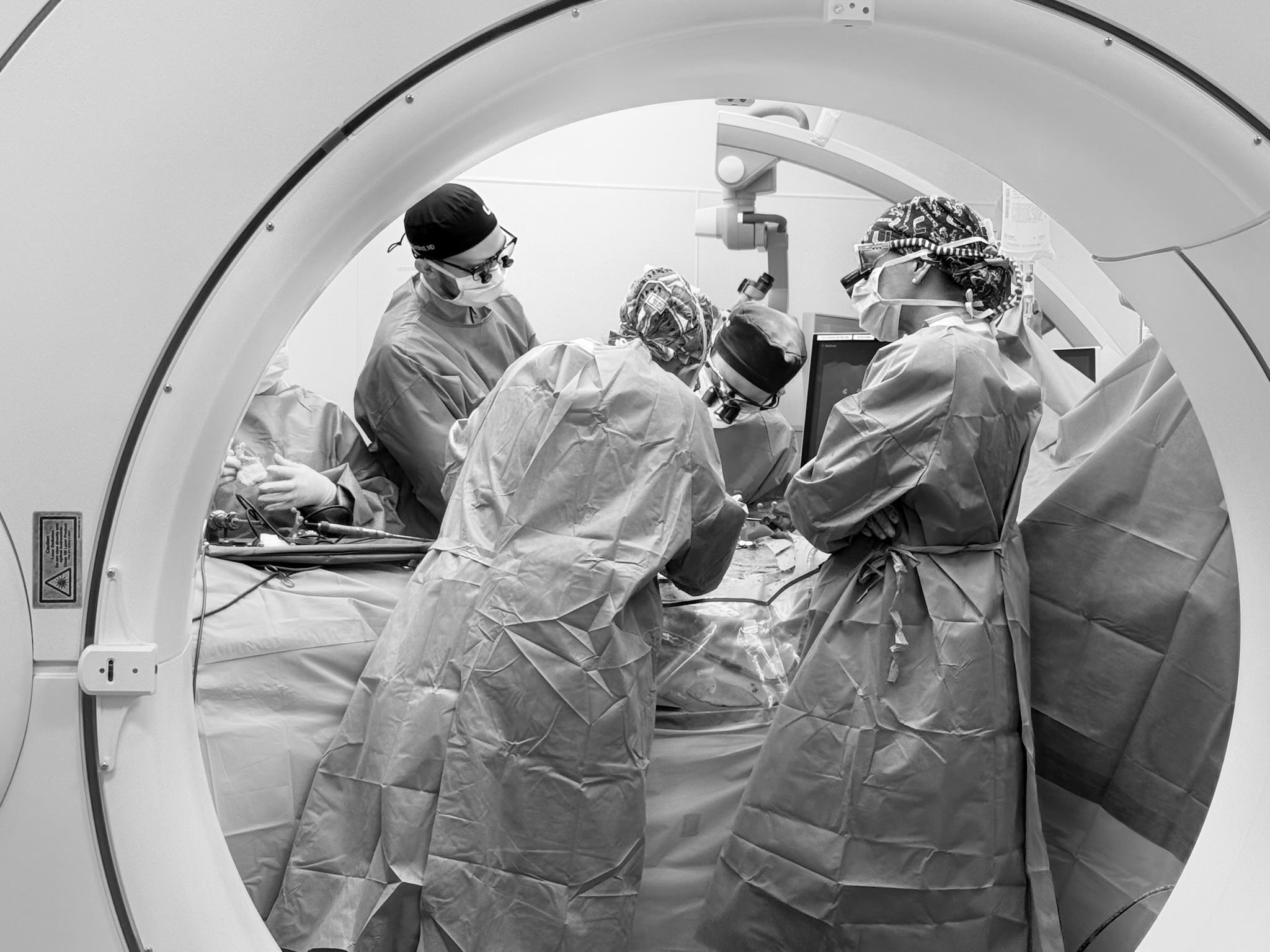The operating-room team working with imaging equipment.